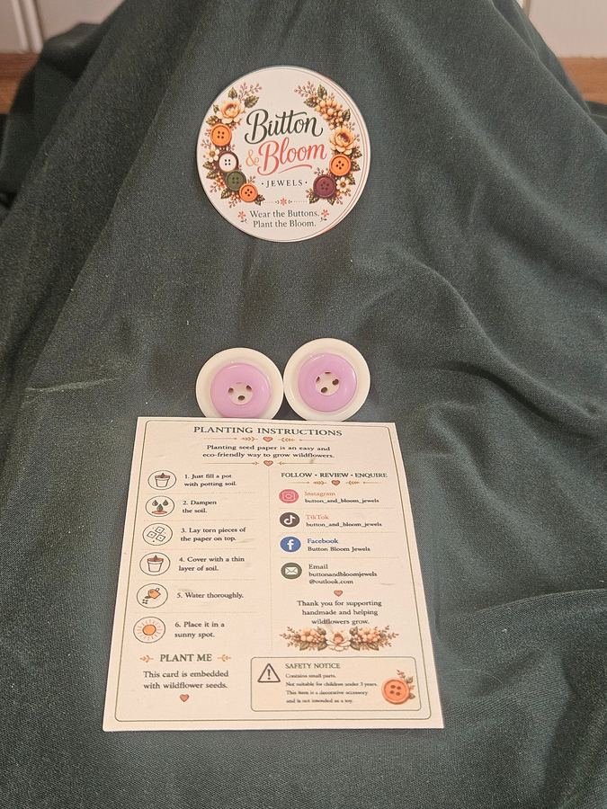Handmade button earrings on wildflower seed packaging